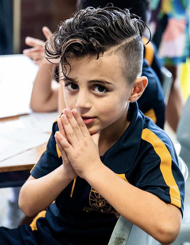 Holy Family Primary East Granville student praying