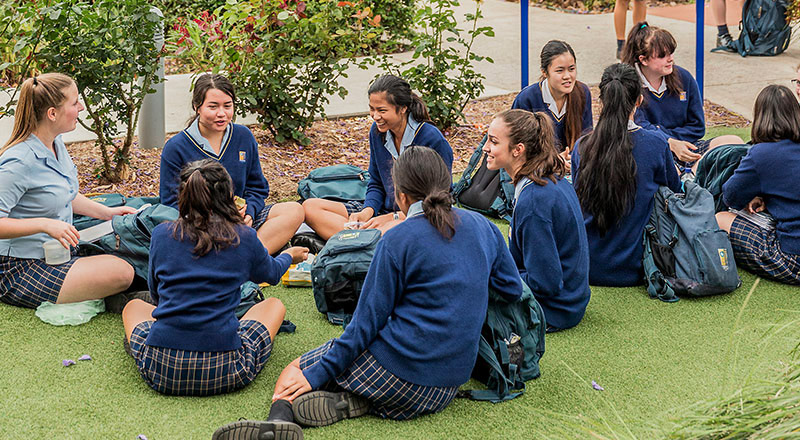 Gilroy Catholic College Castle Hill students sitting outdoors