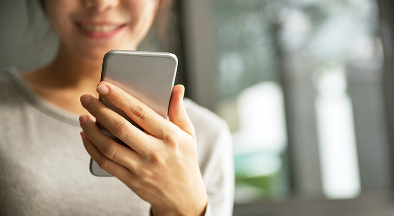 Catholic Schools Parramatta Diocese parent looking at phone