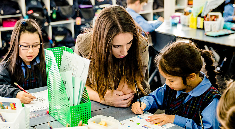 St Margaret Marys Merrylands teacher assisting student