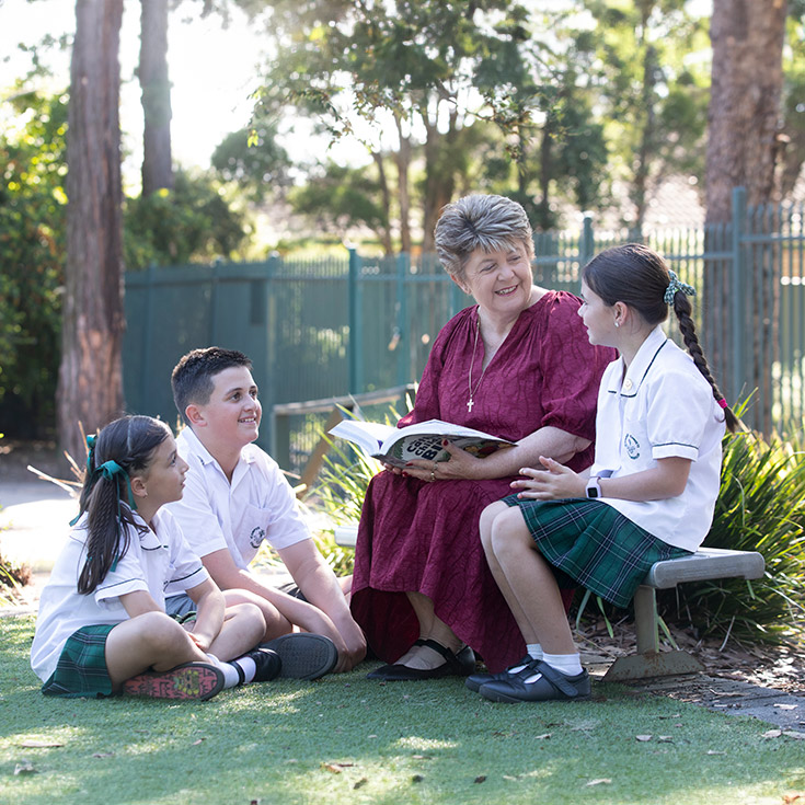 Religious Education teacher with students in Catholic Schools Parramatta Diocese