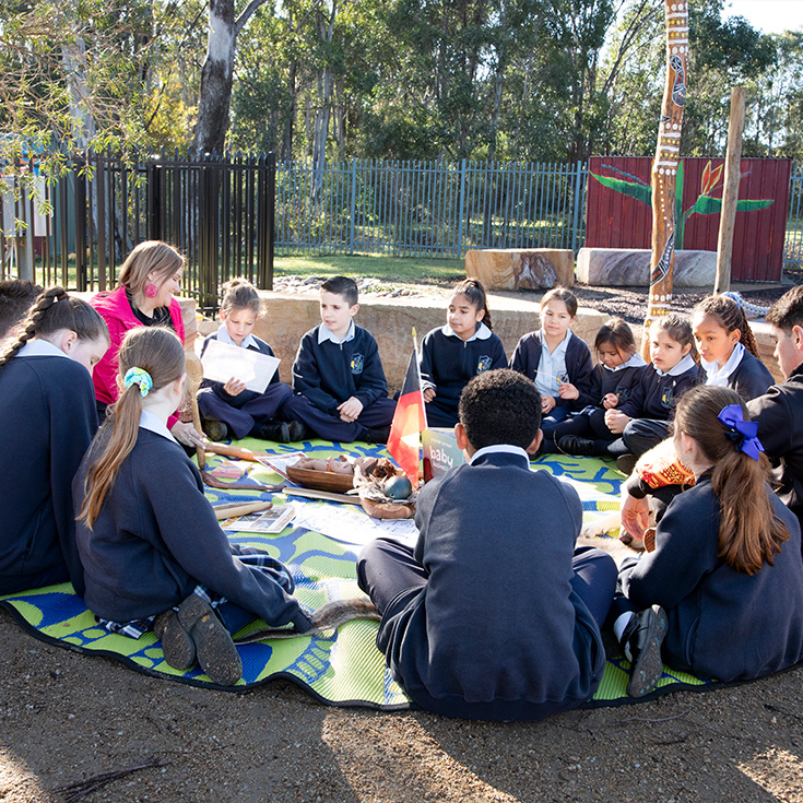 CSPD students from Trinity Primary School Kemps Creek sitting with Jarara team members