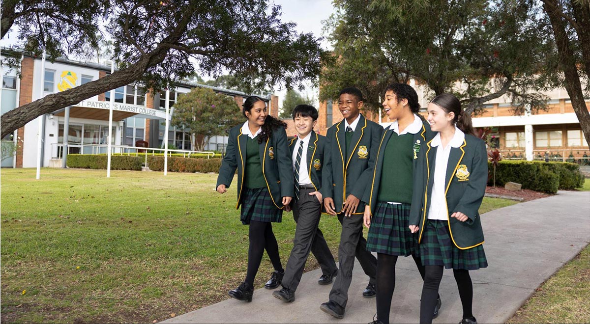 St Parick's Marist College Dundas students walking among the school grounds.
